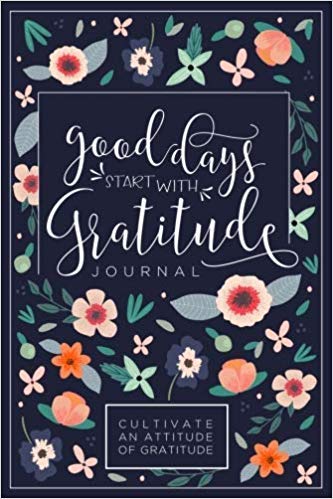 A book cover with flowers and text Description automatically generated